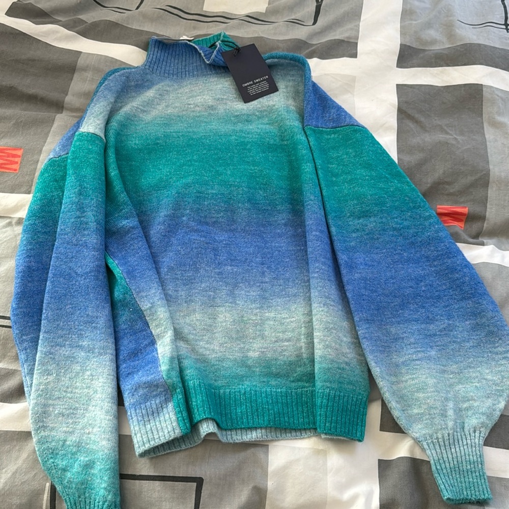 Adorbale brand new woman’s sweater. Runs oversized.  Can be up to size large.